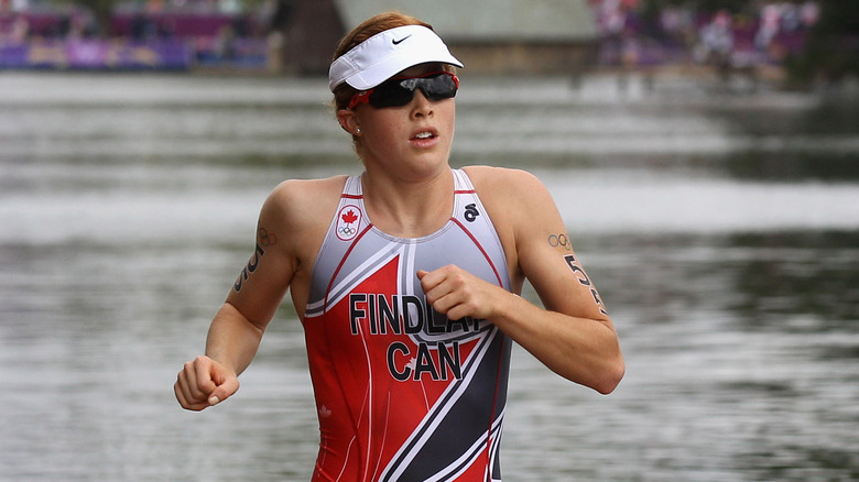 Paula Findlay running in a swimsuit