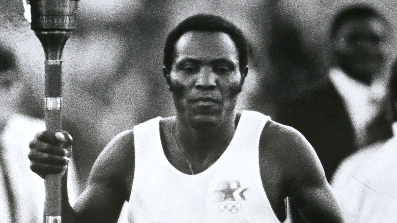 Rafer Johnson carrying a torch