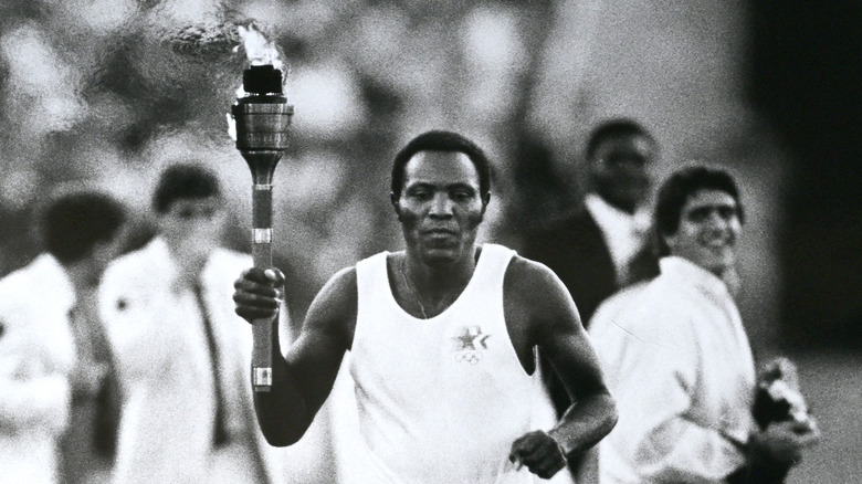 Rafer Johnson carrying a torch