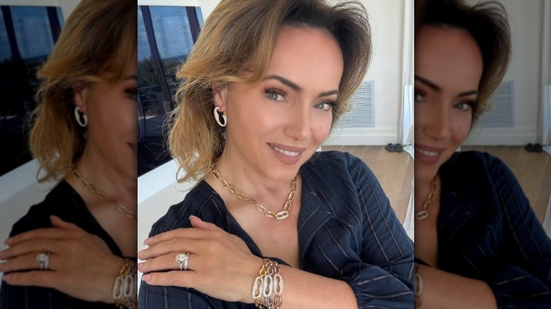Lisa Robertston poses in the jewelry she sells
