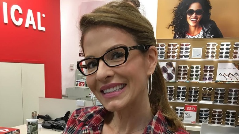 Patti Reilly posing for photo in opticians
