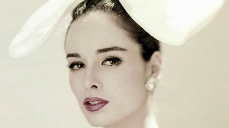 Sondra Peterson poses while wearing a giant white bow