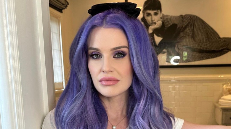 Kelly Osbourne posing