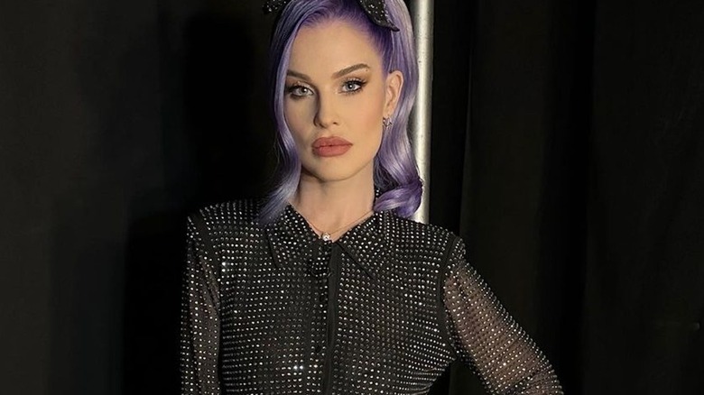 Kelly Osbourne posing