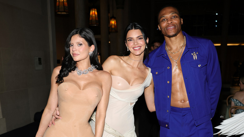 Kendall and Kylie Jenner pose with Russell Westbrook at the 2026 Met Gala.