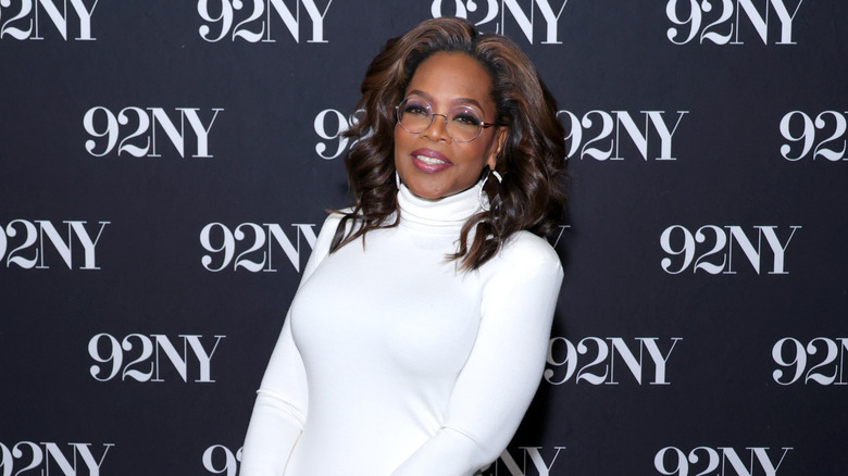 Oprah Winfrey wearing a white dress