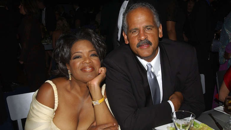 Oprah Wifrey sitting with Steadman Graham 