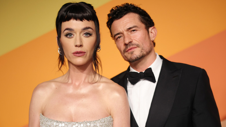 Katy Perry and Orlando Bloom posing at an event