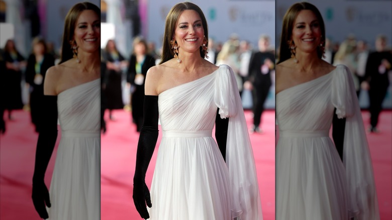 Kate Middleton wearing full length black gloves and a chiffon dress