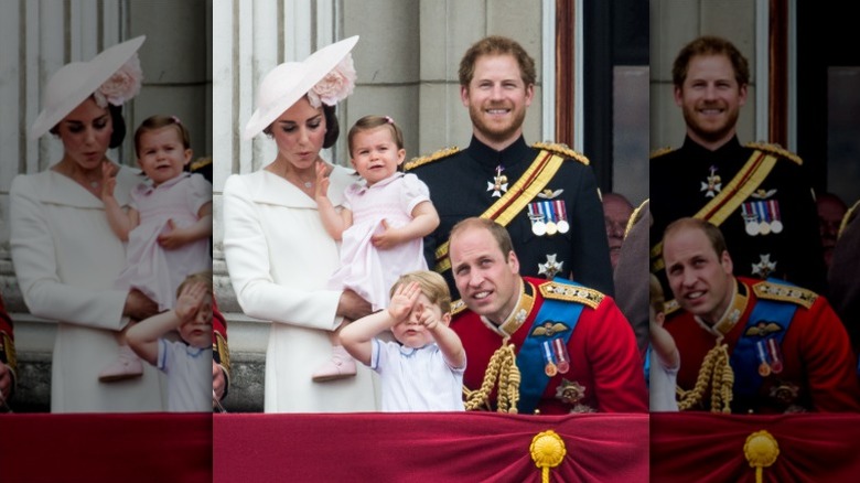 Prince Harry smiles next to Kate Middleton, Prince William, Prince George, and Princess Charlotte