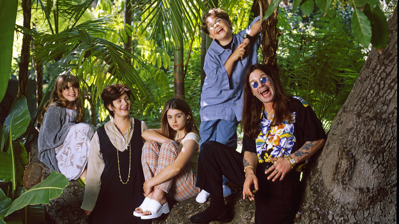 Ozzy and Sharon Osbourne posing with their kids