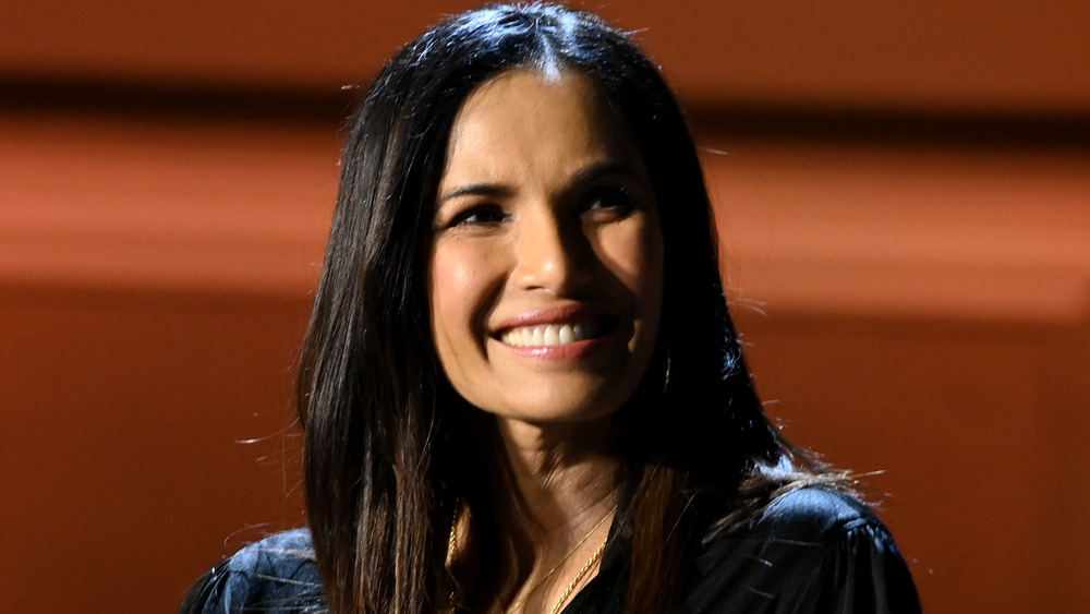 Padma Lakshmi smiling at an event
