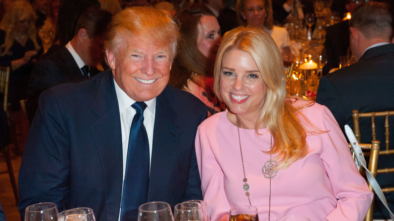 Pam Bondi with Donald Trump at a dinner in 2016