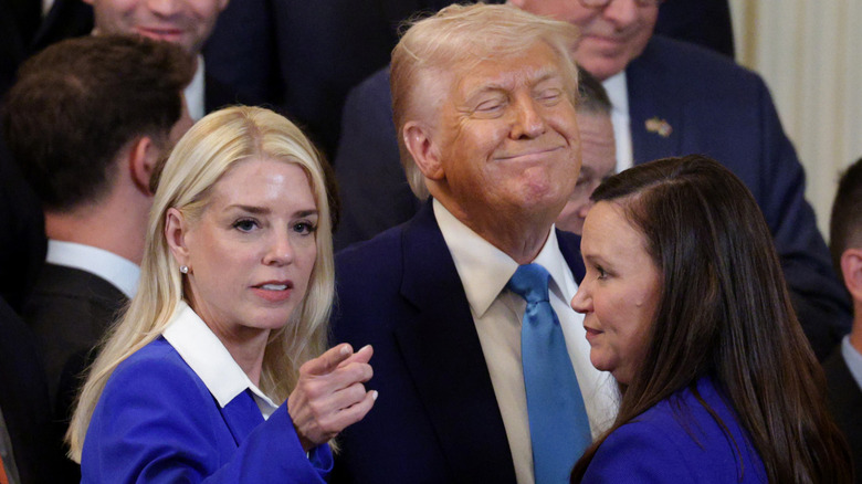 Pam Bondi with Donald Trump in a crowd