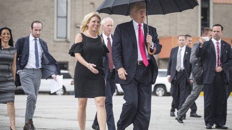 Pam Bondi walking with Donald Trump