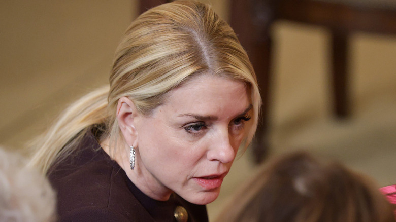 Pam Bondi listening to someone speak