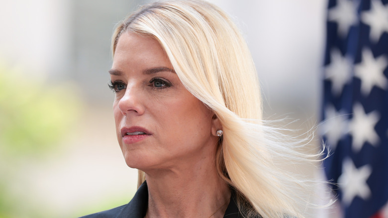 Pam Bondi speaking during a press conference to announce the results of Operation Restore Justice