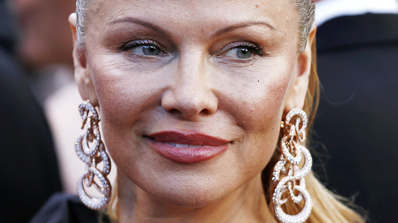 Pamela Anderson wearing earrings