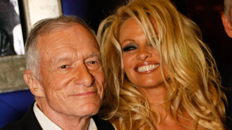Pamela Anderson and Hugh Hefner smiling