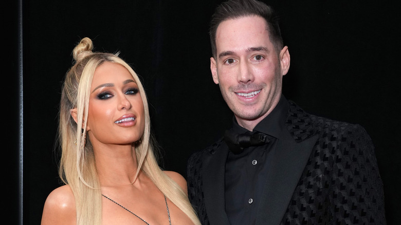 Paris Hilton and Carter Reum posing
