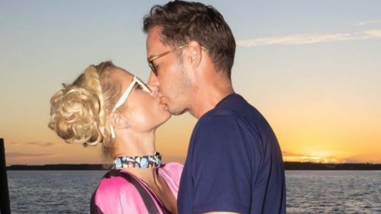 Paris Hilton kissing Carter Reum