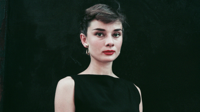 Audrey Hepburn in a black dress around 1955.