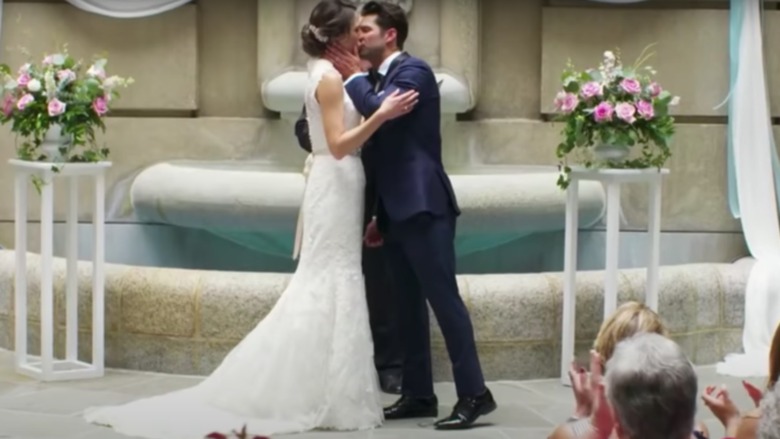Married At First Sight couple kissing at their wedding