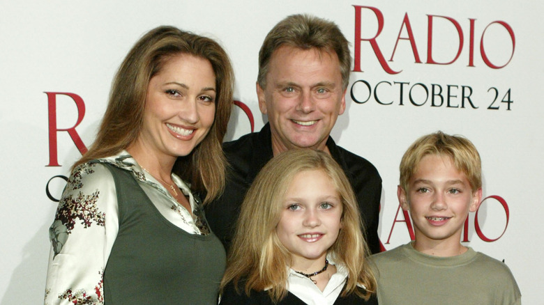 Pat smiling with Maggie and Patrick Sajak, and Lesly Brown
