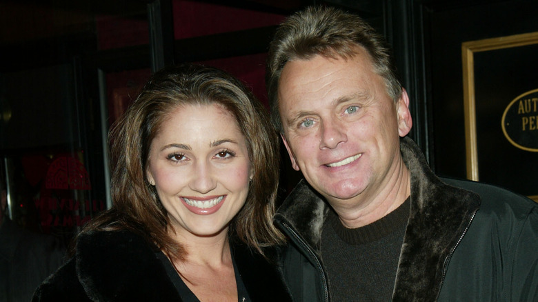 Pat Sajak smiling with Lesly Brown