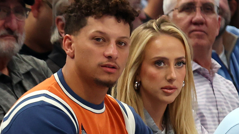 Patrick Mahomes and Brittany Mahomes at a basketball game