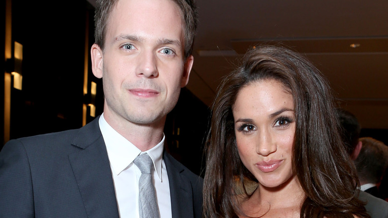 Patrick J. Adams and Meghan Markle smiling