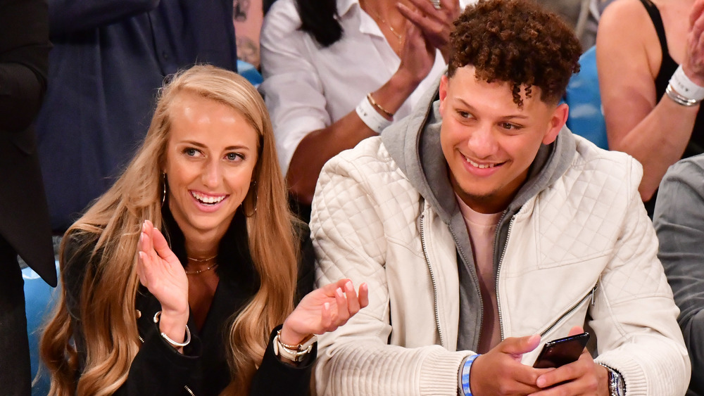 Patrick Mahomes and Brittany Matthews attend a basketball game in 2019