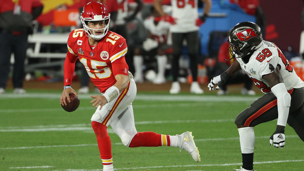 Patrick Mahomes runs from the defense during Super Bowl LV 