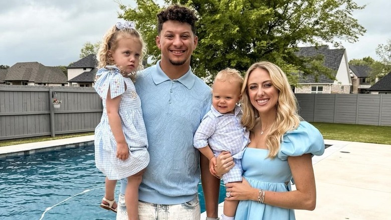 Mahomes family posing by pool