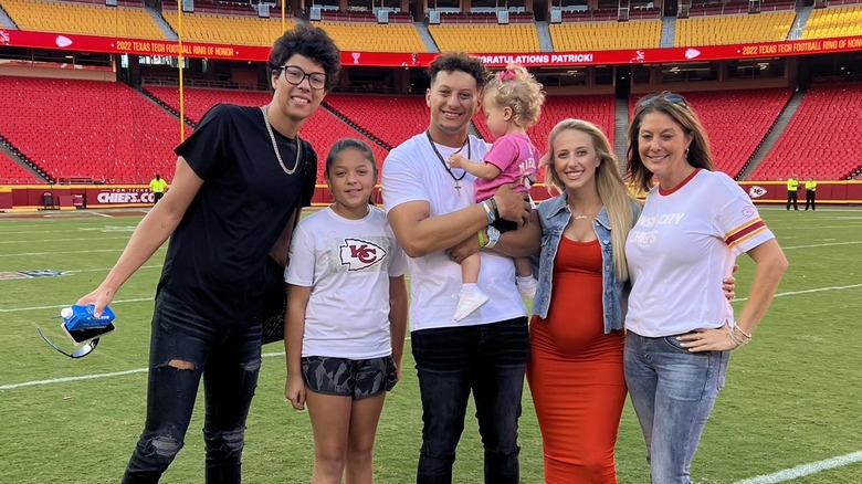 Jackson, Patrick, Brittany, and Randi Mahomes posing