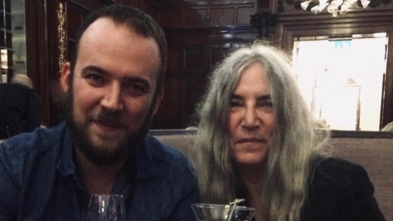 Patti Smith and son Jackson share a drink.
