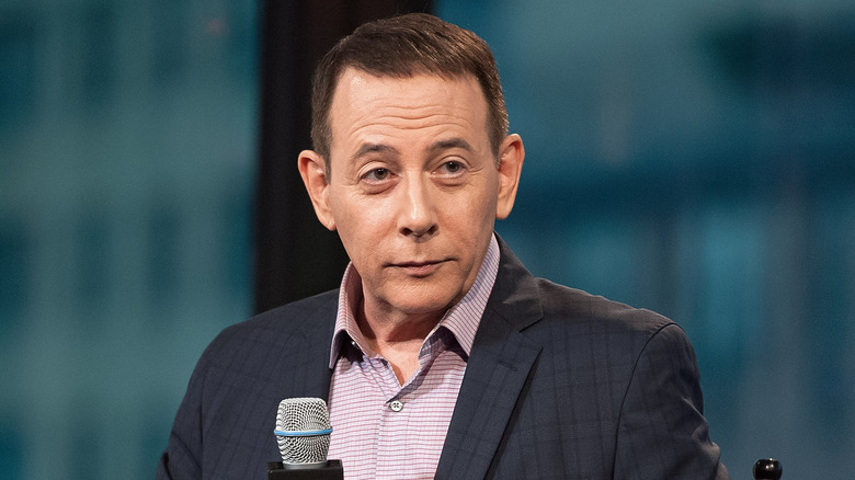 Paul Reubens dark gray jacket