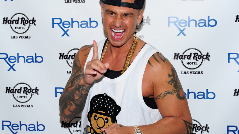 Pauly D poses on a red carpet