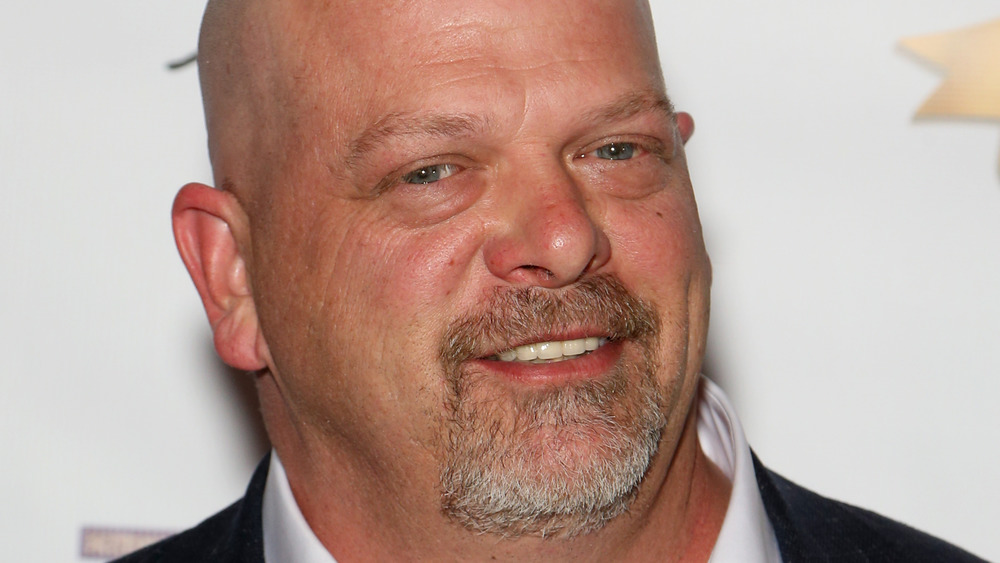 Rick Harrison gives a slight grin on the red carpet