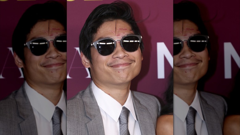 Pax with visible scarring on his face on a 2024 red carpet