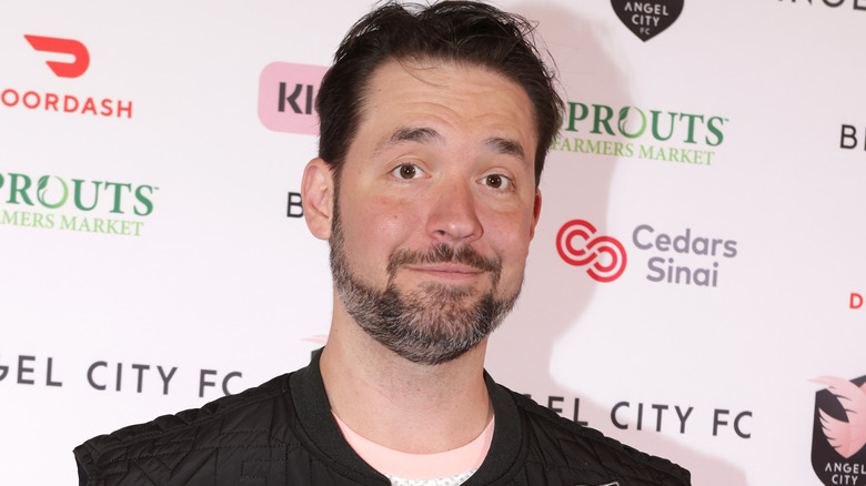 Alexis Ohanian wearing a dark vest and white t-shirt 
