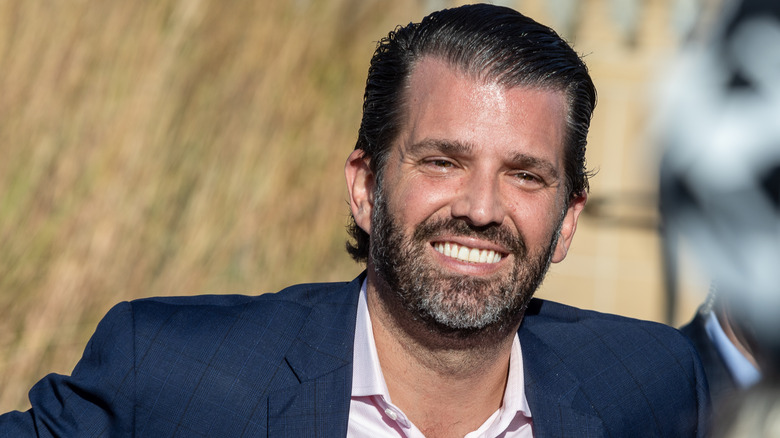 Donald Trump Jr. smiling at event