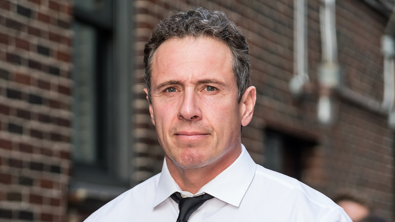 Chris Cuomo frowning in a white shirt with a black tie