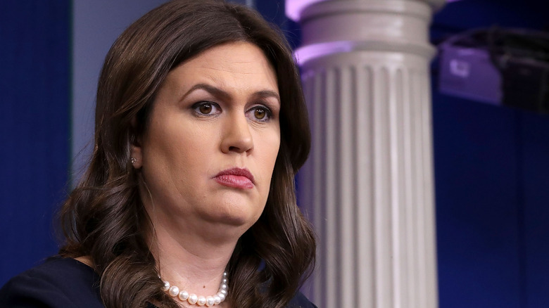 Sarah Huckabee Sanders conducting a news briefing at the White House
