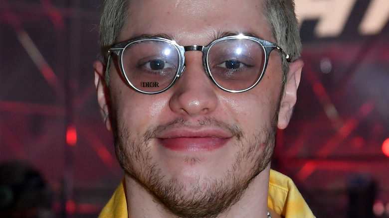 Pete Davidson wearing bleached hair and glasses