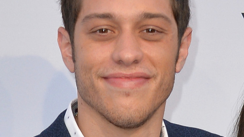 Pete Davidson smiling on the red carpet