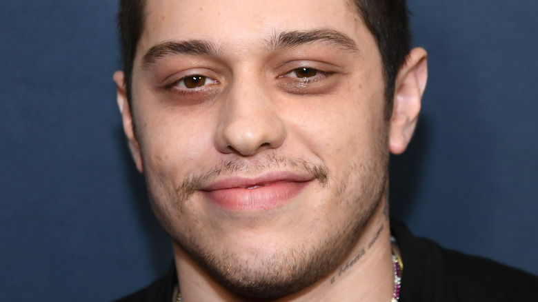 Pete Davidson smirking at the camera