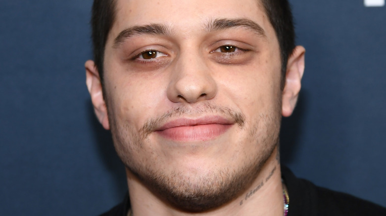 Pete Davidson with slight smile