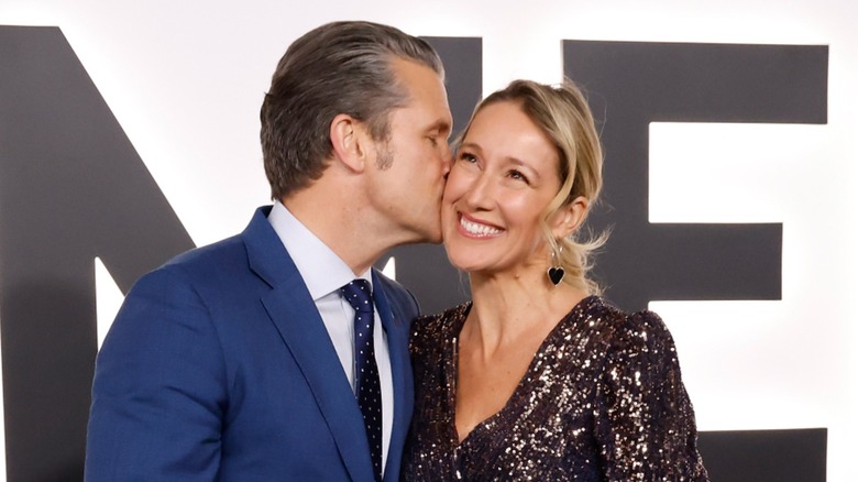 Pete Hegseth kissing his wife on the cheek at the premiere for "Melania"