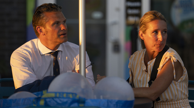 Pete Hegseth sitting outside Ben and Jerry's with his wife, Jennifer Rauchet while visiting The Wharf